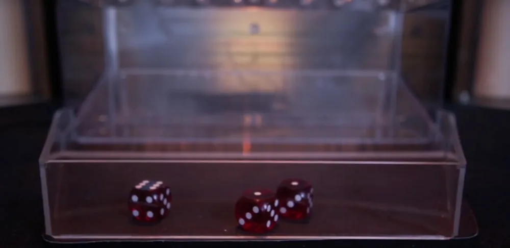 Three dice settled at the base of the Lightning Dice tower
